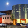 Eastgate Oriental City complex at night, John T Architects